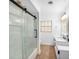 Modern bathroom featuring glass shower and double vanity sink with granite countertop at 1100 Snell Isle Ne Blvd, St Petersburg, FL 33704