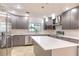 Modern kitchen with stainless steel appliances, white countertops, and gray cabinetry with ample storage at 1100 Snell Isle Ne Blvd, St Petersburg, FL 33704
