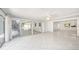 Bright living area features tile flooring with backyard access through large glass sliding doors at 1100 Snell Isle Ne Blvd, St Petersburg, FL 33704