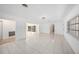 Bright living room features tiled flooring and a view of the pool area through sliding glass doors at 1100 Snell Isle Ne Blvd, St Petersburg, FL 33704