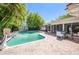 Backyard featuring sparkling pool, brick pavers and outdoor dining at 1100 Snell Isle Ne Blvd, St Petersburg, FL 33704