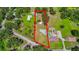 Aerial view of the property with a large open backyard and tree coverage at 1105 Branch Acres Dr, Plant City, FL 33565