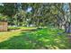Beautiful lush backyard with mature trees at 1105 Branch Acres Dr, Plant City, FL 33565