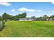 Lush green lawn and home's exterior featuring a large yard at 1105 Branch Acres Dr, Plant City, FL 33565