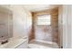 Bathroom features tiled walls, a tub, and vanity with sink at 12113 Victory Dr, Hudson, FL 34667