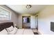 Staged bedroom features neutral walls, carpeted floors, closet, and a large bed at 12113 Victory Dr, Hudson, FL 34667