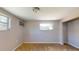 Vacant bedroom features neutral walls, carpeted floors and a window AC unit at 12113 Victory Dr, Hudson, FL 34667
