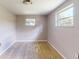 Bedroom with two windows showing the view outside, offering lots of natural light at 12113 Victory Dr, Hudson, FL 34667