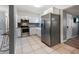 Bright kitchen with stainless steel appliances, white cabinets, and ample counter space at 124 E Virginia Ln, Clearwater, FL 33759