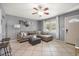 Comfortable living room with a ceiling fan, tile floors, and a sectional sofa at 124 E Virginia Ln, Clearwater, FL 33759