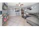 Spacious open-concept area connects living room to kitchen, with bar seating and modern decor at 124 E Virginia Ln, Clearwater, FL 33759
