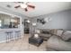 Spacious open-concept area connects living room to kitchen, with bar seating and modern decor at 124 E Virginia Ln, Clearwater, FL 33759