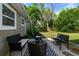 Patio with an outdoor seating area and a view of the backyard at 124 E Virginia Ln, Clearwater, FL 33759