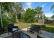 Patio in fenced backyard featuring an outdoor lounge area at 124 E Virginia Ln, Clearwater, FL 33759