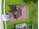 An overhead shot of a well-maintained home, showcasing the roof, landscaping, and expansive yard at 12915 Carlington Ln, Riverview, FL 33579