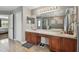 The bathroom boasts double sinks, a soaking tub, and separate shower at 12915 Carlington Ln, Riverview, FL 33579