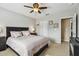 Comfortable bedroom featuring a ceiling fan, neutral color scheme, and a well-maintained carpet at 12915 Carlington Ln, Riverview, FL 33579