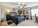 Well-decorated bedroom with dark wooden bed frame and ceiling fan at 12915 Carlington Ln, Riverview, FL 33579