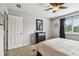 Bedroom with neutral walls, a ceiling fan, carpet, and a window with black-out curtains at 12915 Carlington Ln, Riverview, FL 33579