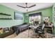 Bedroom with black bed frame and accents and bright green walls at 12915 Carlington Ln, Riverview, FL 33579
