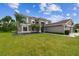 Exterior of home featuring a well-maintained lawn and landscaping and large two car garage at 12915 Carlington Ln, Riverview, FL 33579