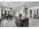 Bright kitchen with center island and breakfast nook offering a view to dining area at 12915 Carlington Ln, Riverview, FL 33579
