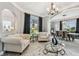 Inviting living room with stylish furniture, chandelier, large windows and open access to dining area at 12915 Carlington Ln, Riverview, FL 33579