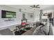 Comfortable living room features tile flooring, a neutral palette, stylish decor, and ample seating space at 12915 Carlington Ln, Riverview, FL 33579