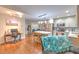 Open-concept living area showcasing a kitchen, office space, and cozy seating area at 13311 Omega Ct, Dade City, FL 33525