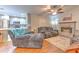 Inviting living room with a cozy fireplace and seamless transition to the kitchen area at 13311 Omega Ct, Dade City, FL 33525