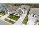 Aerial view showcasing the home's exterior, surrounding yard and neighborhood at 14672 Horse Trot Rd, Lithia, FL 33547