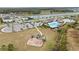 Community playground area featuring swings and slides with seating areas and parking nearby at 14672 Horse Trot Rd, Lithia, FL 33547