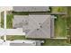 An aerial view of the home displaying its roof, yard, driveway, and neighborhood surroundings at 14672 Horse Trot Rd, Lithia, FL 33547