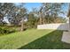 Expansive backyard with lush green lawn and mature trees at 14672 Horse Trot Rd, Lithia, FL 33547