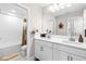 Bright bathroom featuring a double sink vanity and bath at 14672 Horse Trot Rd, Lithia, FL 33547