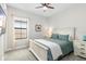 Cozy bedroom features a queen-size bed, soft carpet, neutral walls, and a large window at 14672 Horse Trot Rd, Lithia, FL 33547