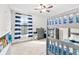 bedroom with bunkbeds and large window with striped curtains at 14672 Horse Trot Rd, Lithia, FL 33547