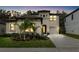 Stunning front exterior view of the two-story home with a well manicured lawn and beautiful landscaping at 14672 Horse Trot Rd, Lithia, FL 33547