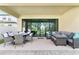 Spacious covered patio with comfortable seating, perfect for outdoor entertaining at 14672 Horse Trot Rd, Lithia, FL 33547