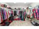 Spacious walk-in closet with ample storage and shelving at 14672 Horse Trot Rd, Lithia, FL 33547