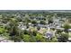 Aerial view displays neighborhood homes among lush greenery under clear skies at 2017 Waikiki Way, Tampa, FL 33619