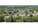 An aerial view showing the residential properties in a neighborhood with a verdant backdrop at 2017 Waikiki Way, Tampa, FL 33619