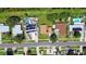 An aerial, street-level view highlighting homes, green yards and local traffic at 2017 Waikiki Way, Tampa, FL 33619