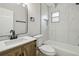 Beautiful bathroom with a modern vanity, marble tile, and updated fixtures at 2017 Waikiki Way, Tampa, FL 33619