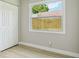 Bright bedroom with closet and view to fenced backyard at 2017 Waikiki Way, Tampa, FL 33619