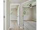 Bright bedroom showcasing new light wood floors and modern ceiling fan at 2017 Waikiki Way, Tampa, FL 33619