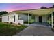 Home's spacious covered carport with backyard access at 2017 Waikiki Way, Tampa, FL 33619