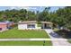 Lovely house boasting a spacious front yard, covered carport, and beautiful landscaping at 2017 Waikiki Way, Tampa, FL 33619