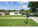 Charming single-story home with a covered carport, neat landscaping, and freshly cut green grass at 2017 Waikiki Way, Tampa, FL 33619