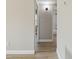Neutral hallway with light wood floors offering access to the bathroom and bedroom, providing ample light at 2017 Waikiki Way, Tampa, FL 33619